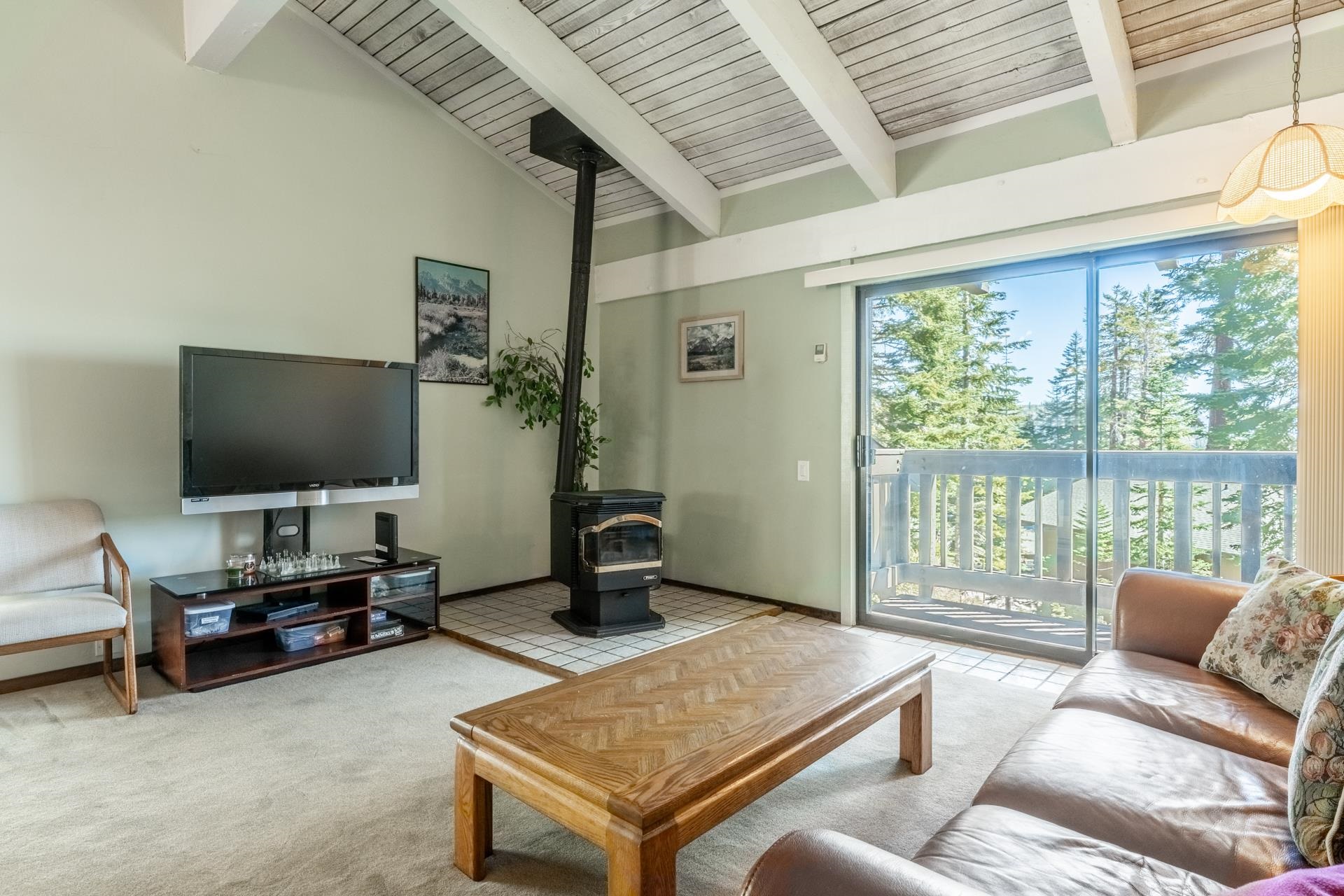 94 John Muir Road, Unit 132 Mammoth Lakes, CA 93546 - Photo 7 of 58 a living room with furniture and a flat screen tv
