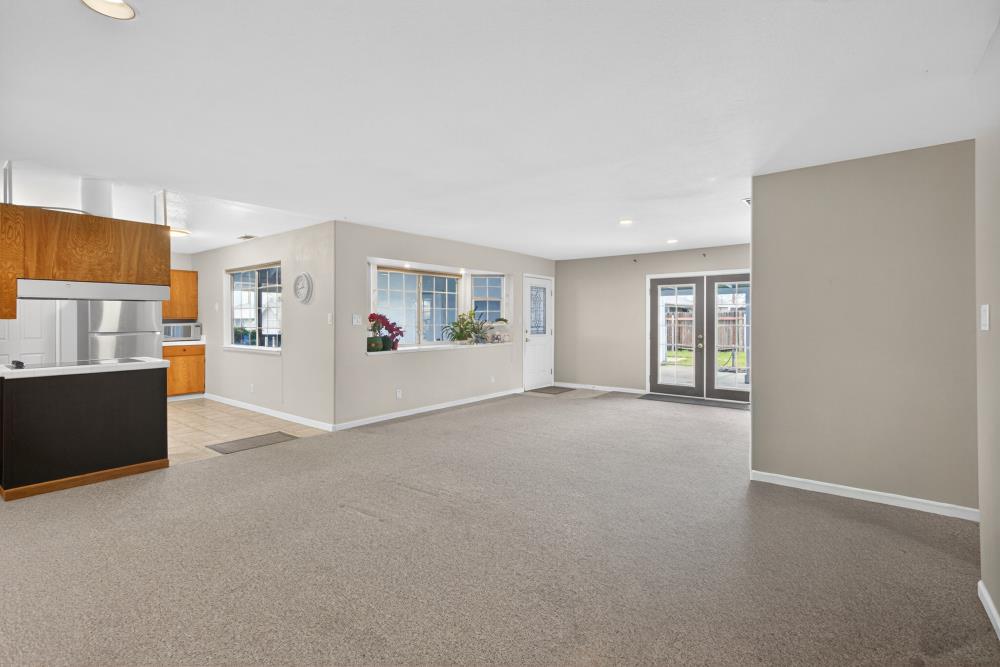 7213 Coronet Court Citrus Heights, CA 95621 - Photo 11 of 52 a view of a big room with windows and chandelier