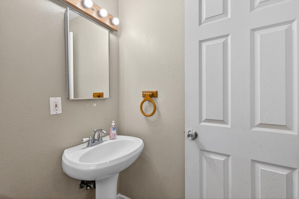 7213 Coronet Court Citrus Heights, CA 95621 - Photo 22 of 52 a bathroom with a sink and a mirror