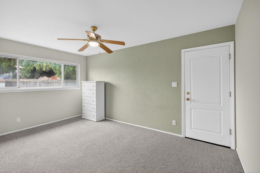 7213 Coronet Court Citrus Heights, CA 95621 - Photo 27 of 52 an empty room with windows and fan
