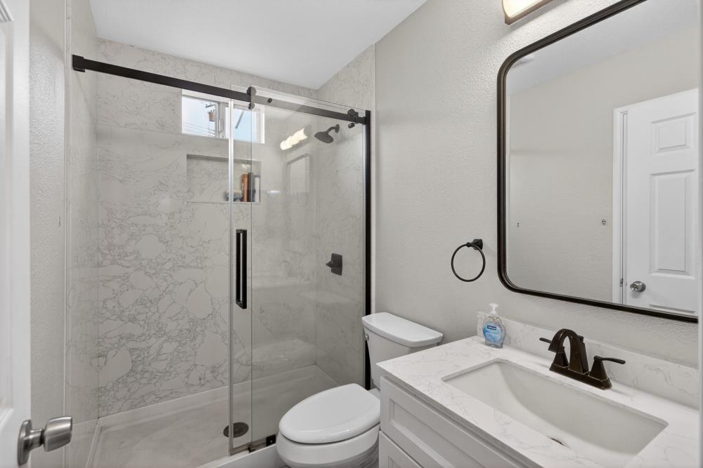 7213 Coronet Court Citrus Heights, CA 95621 - Photo 31 of 52 a bathroom with a sink toilet and shower