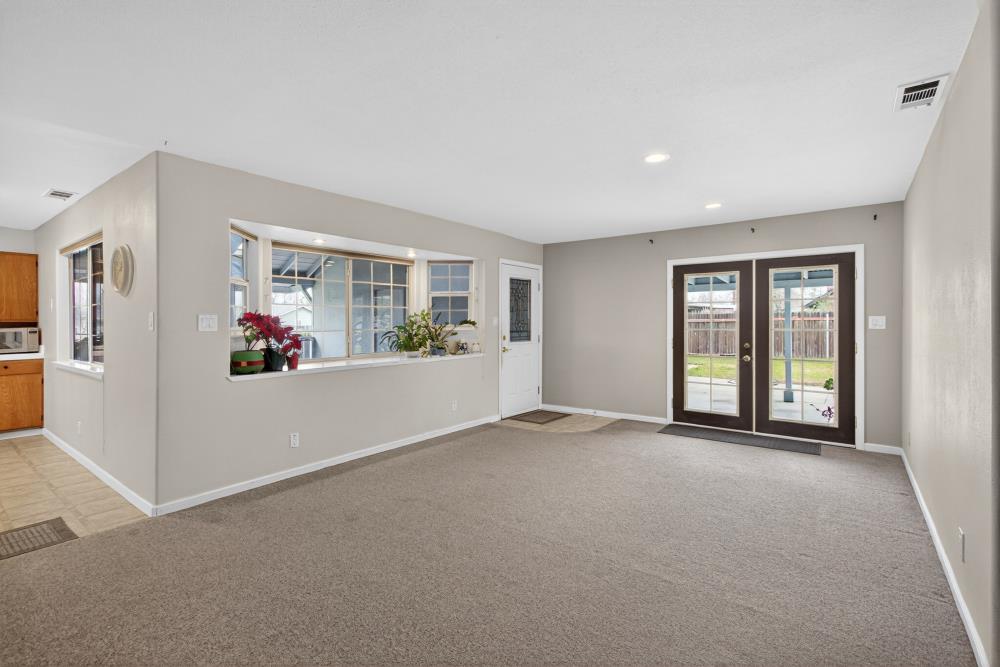 7213 Coronet Court Citrus Heights, CA 95621 - Photo 8 of 52 a view of a big room with windows and chandelier