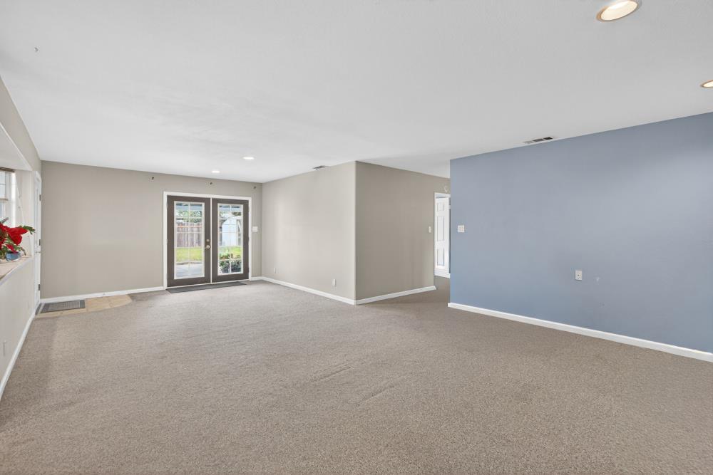 7213 Coronet Court Citrus Heights, CA 95621 - Photo 10 of 52 a view of an empty room with window and wooden floor