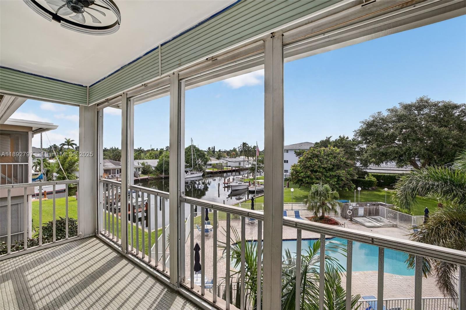 900 Southwest 12th Street, Unit 305 Fort Lauderdale, FL 33315 - Photo 2 of 72 Impact windows to screened Porch overlooking water & pool. Flat Ceilings with high hat lighting. Garden & Water Views. Updated flooring and paint, Impact Windows