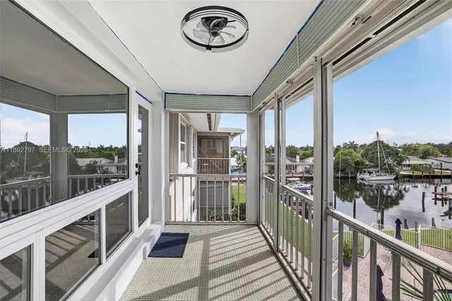 a view of hallway with stainless steel appliances granite countertop and refrigerator