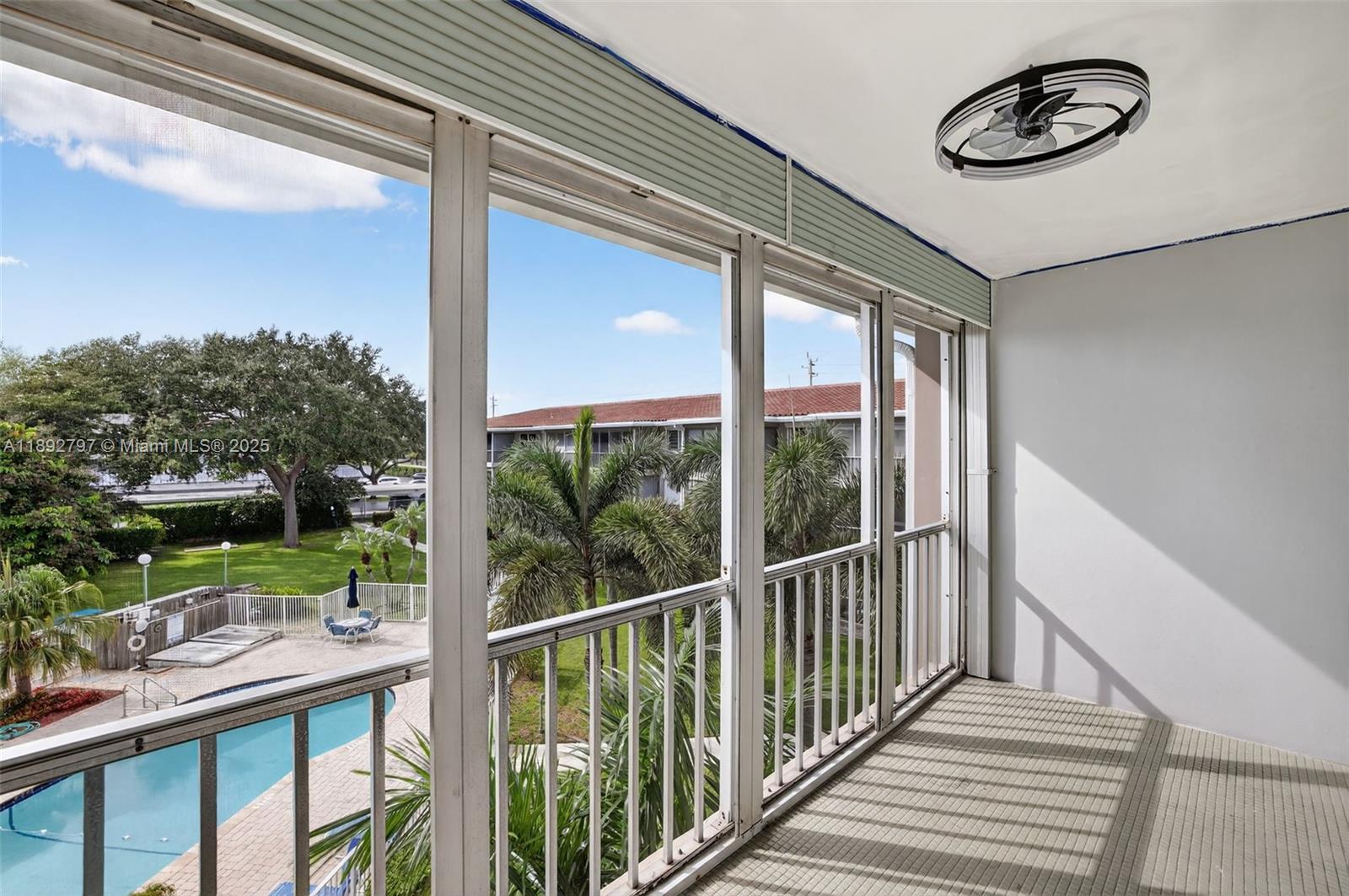900 Southwest 12th Street, Unit 305 Fort Lauderdale, FL 33315 - Photo 24 of 72 Impact windows to screened Porch overlooking water & pool. Flat Ceilings with high hat lighting. Garden & Water Views. Updated flooring and paint, Impact Windows