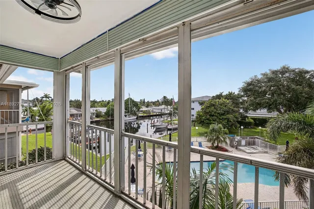 a view of a swimming pool with a patio