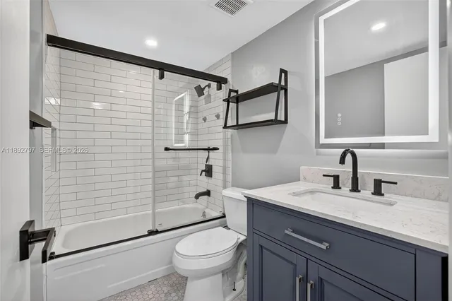 an aerial view of residential houses with outdoor space and swimming pool