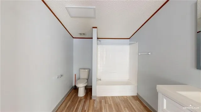 a kitchen with a refrigerator and a sink