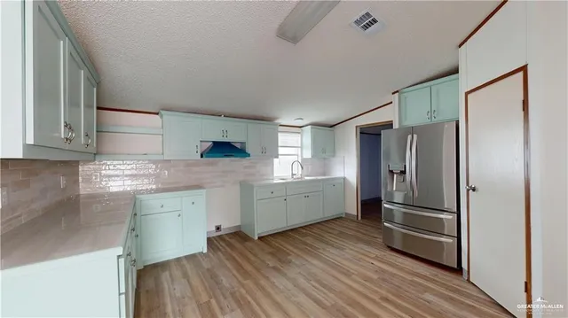 a kitchen with cabinets a sink and dishwasher