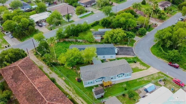 an aerial view of houses with yard