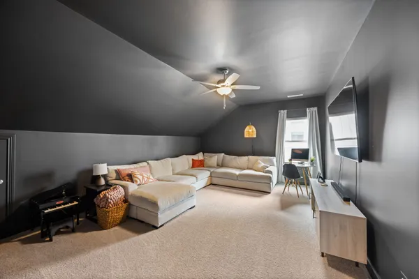 a bedroom with furniture and a chandelier