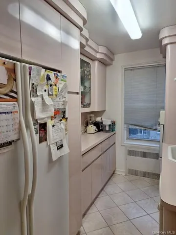 a kitchen with stainless steel appliances a refrigerator and cabinets