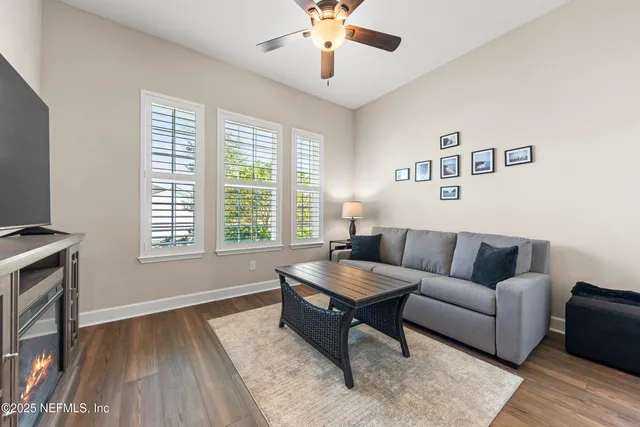 a bathroom with a granite countertop sink a mirror and a shower