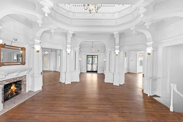 a view of livingroom with fireplace wooden floor and furniture