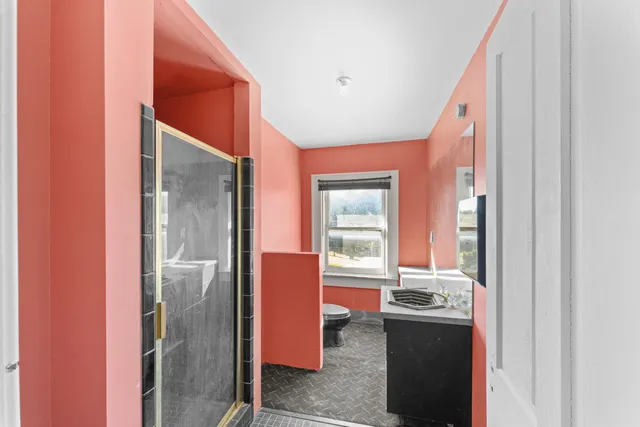 a view of an empty room with windows