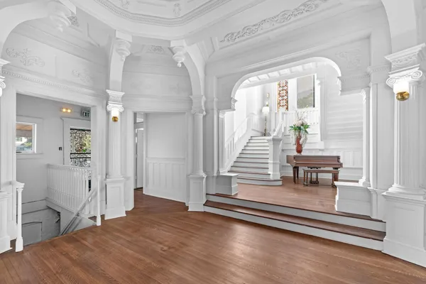 a view of livingroom with fireplace wooden floor and furniture