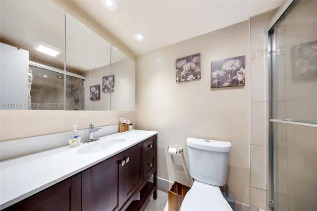 a kitchen that has a lot of cabinets in it and a sink