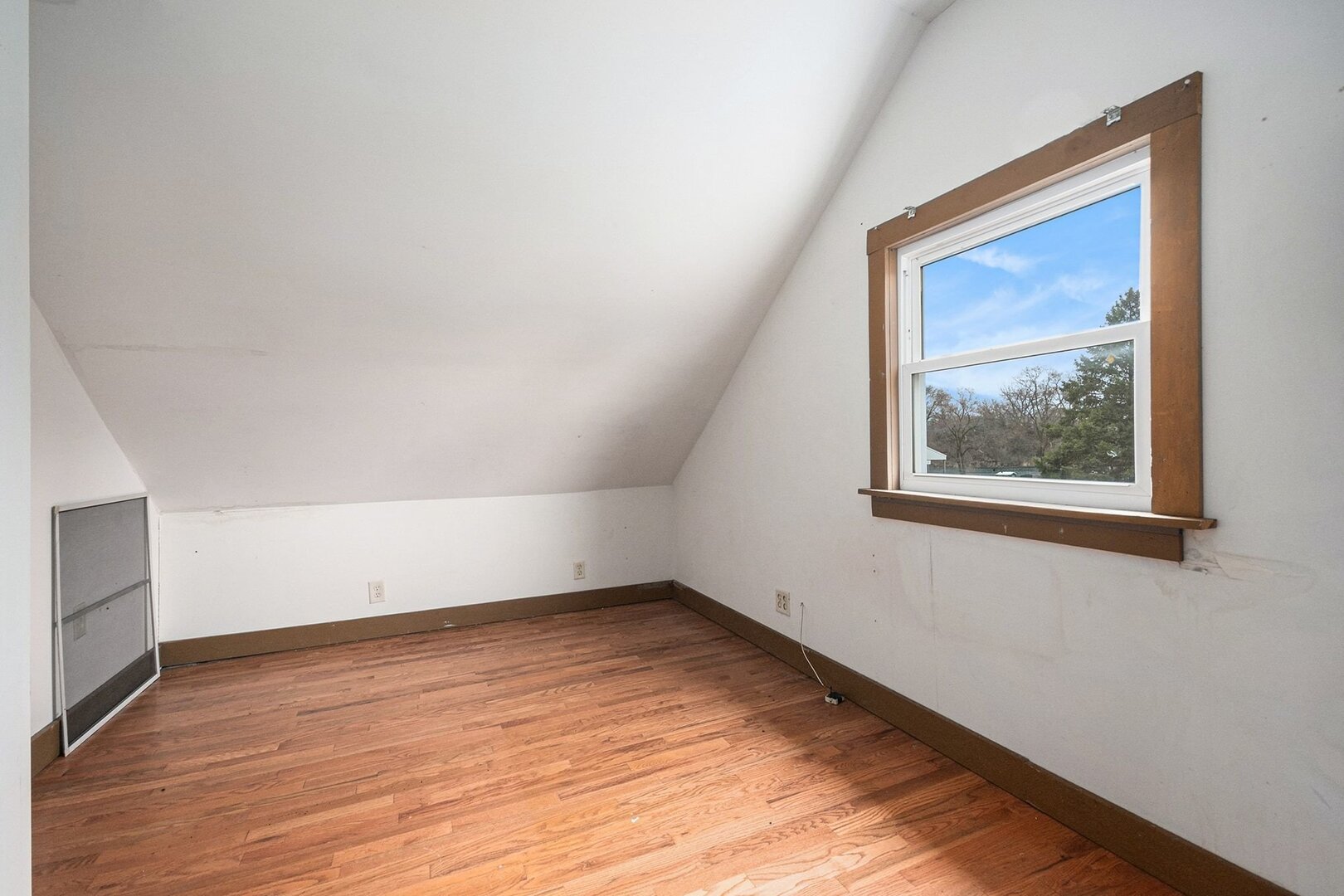 265 Monroe Street Gardner, IL 60424 - Photo 14 of 25 an empty room with wooden floor and windows