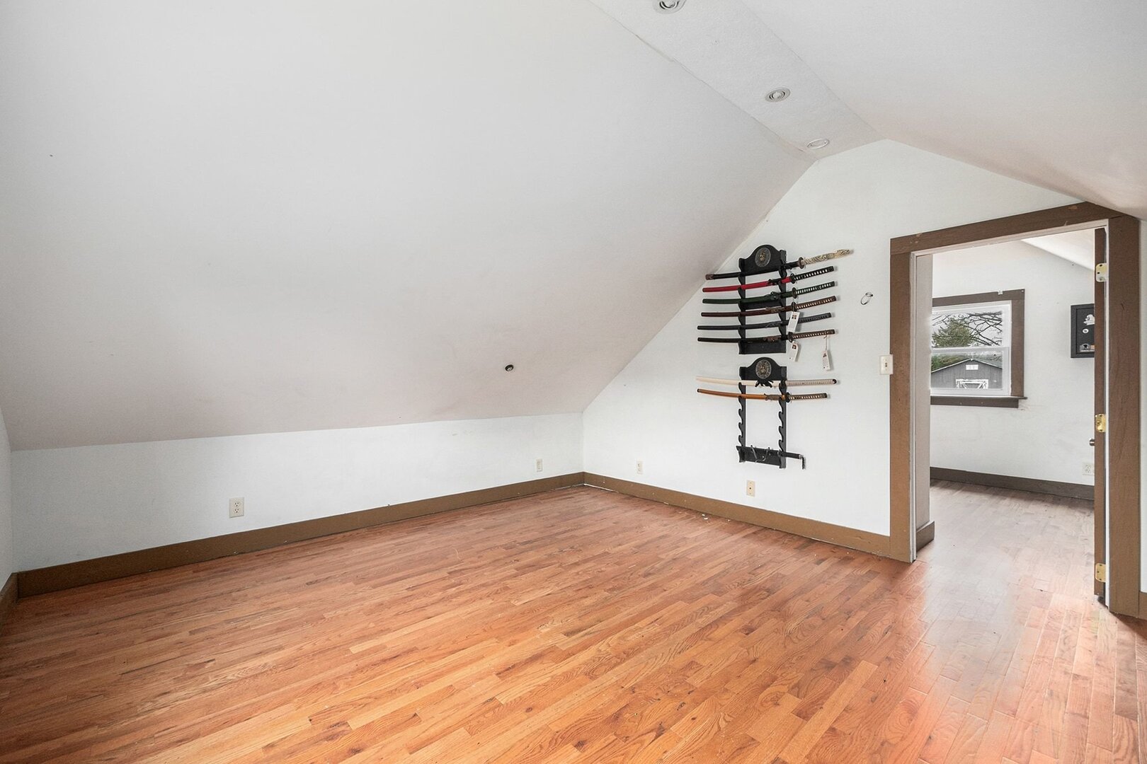 265 Monroe Street Gardner, IL 60424 - Photo 20 of 25 an empty room with wooden floor and stairs