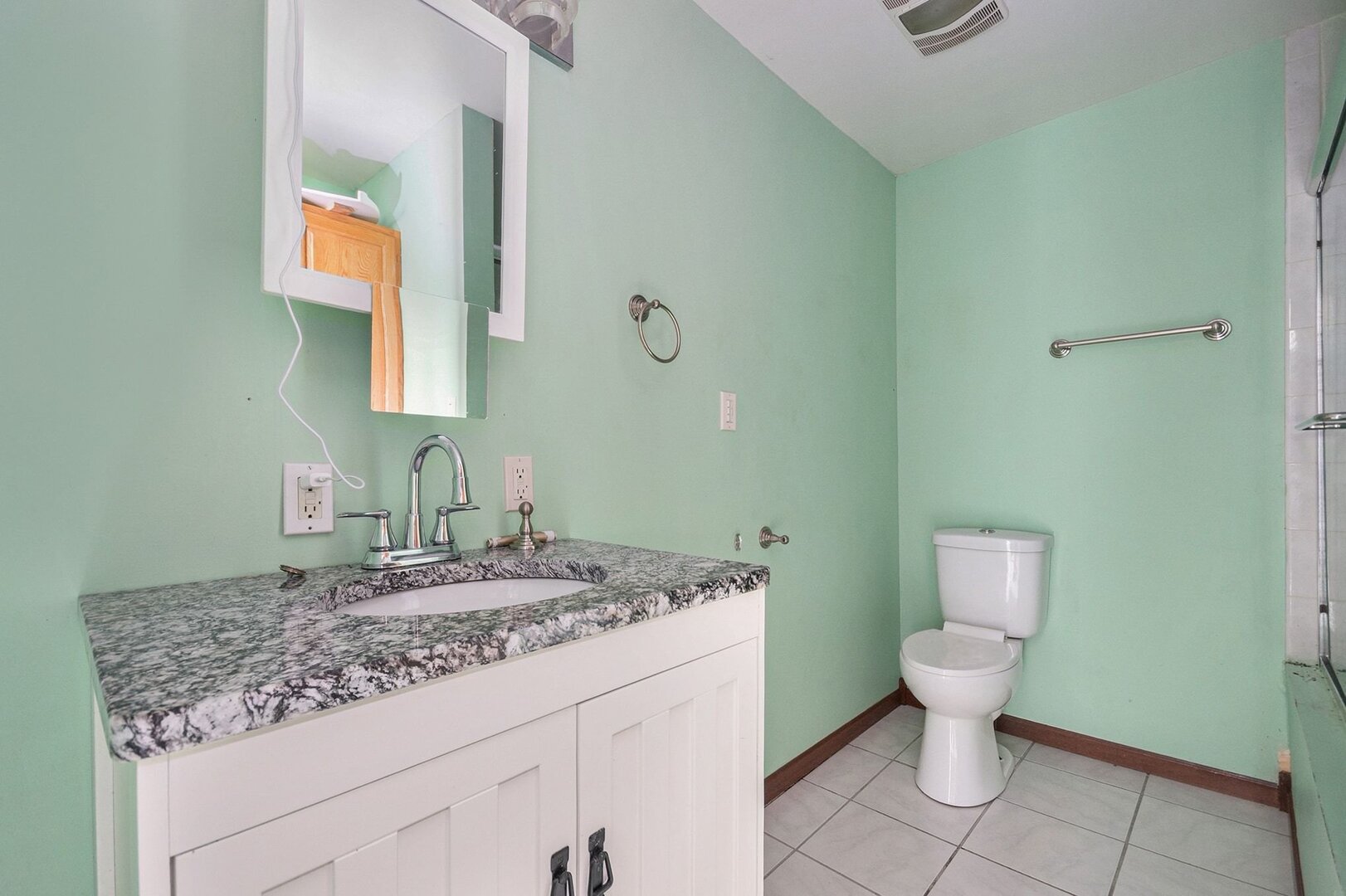 265 Monroe Street Gardner, IL 60424 - Photo 5 of 25 a bathroom with a granite countertop toilet and sink