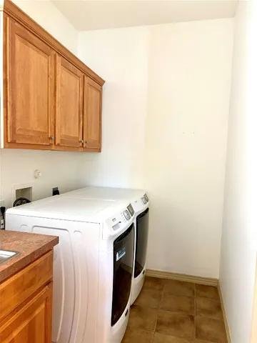 a utility room with washer and dryer