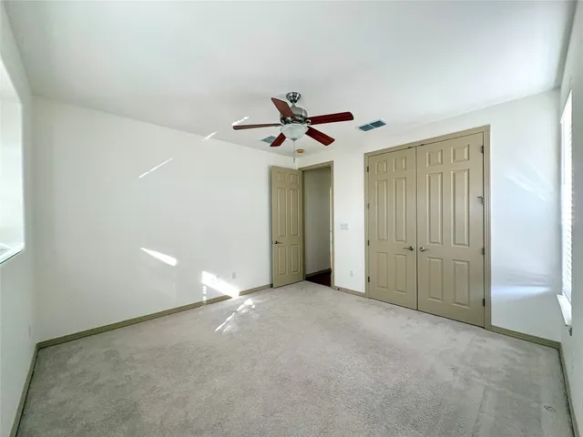 a view of a chandelier fan in a room