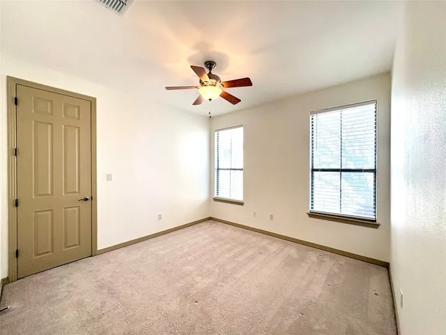 a bathroom with a double vanity sink toilet mirror and bathtub