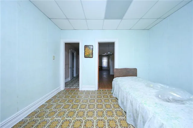 a kitchen with a sink window and cabinets