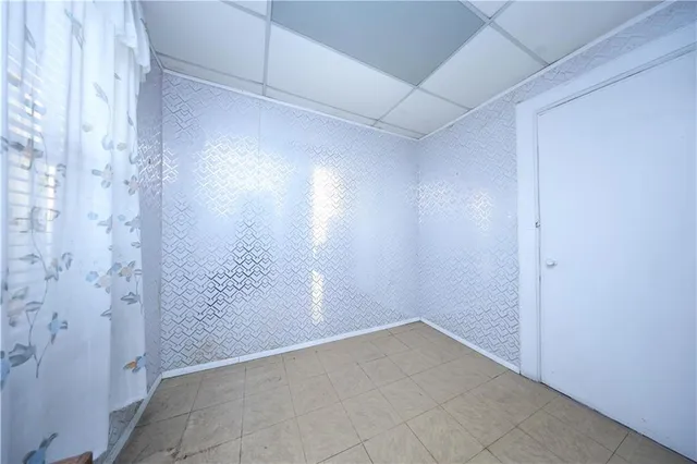 a kitchen with a refrigerator and a stove top oven