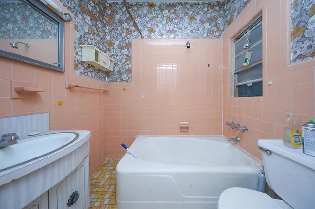 a view of a kitchen with a sink and cabinet