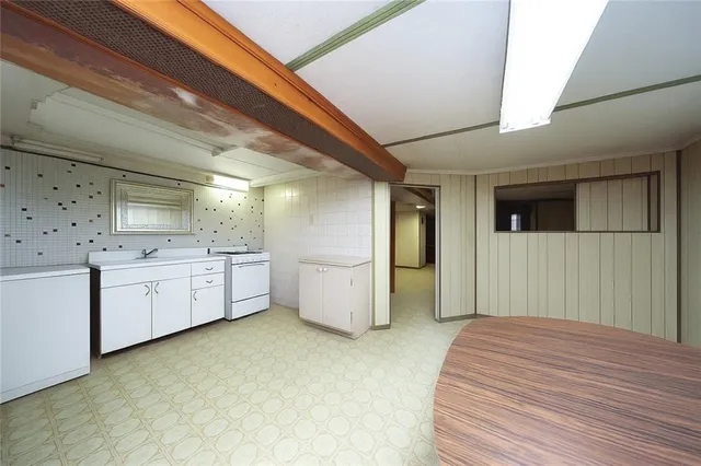 a bathroom with a sink a toilet and a shower