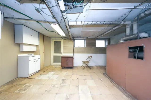 a view of a brick building next to a yard