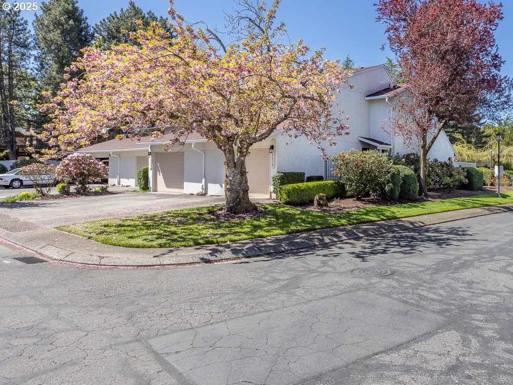3318 Northeast 29th Street Gresham, OR 97030 - Photo 1 of 32 a front view of a house with a garden and trees