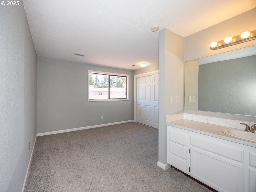 3318 Northeast 29th Street Gresham, OR 97030 - Photo 23 of 32 a view of an empty room and window and a kitchen