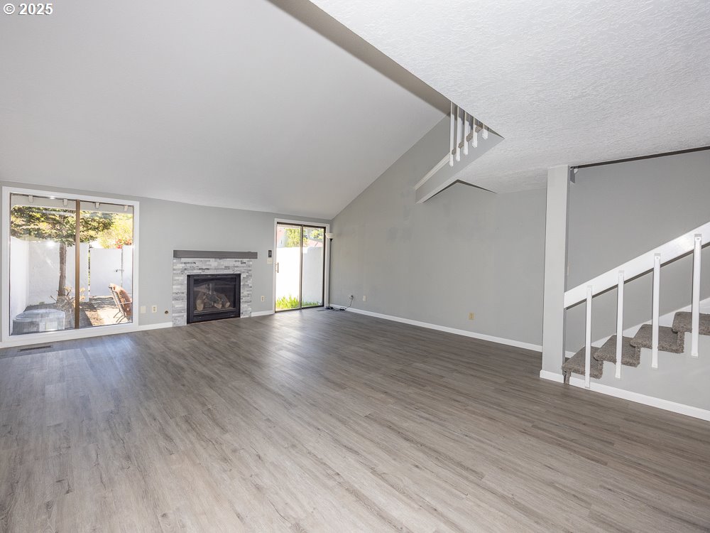 3318 Northeast 29th Street Gresham, OR 97030 - Photo 24 of 32 a view of empty room with fireplace and wooden floor