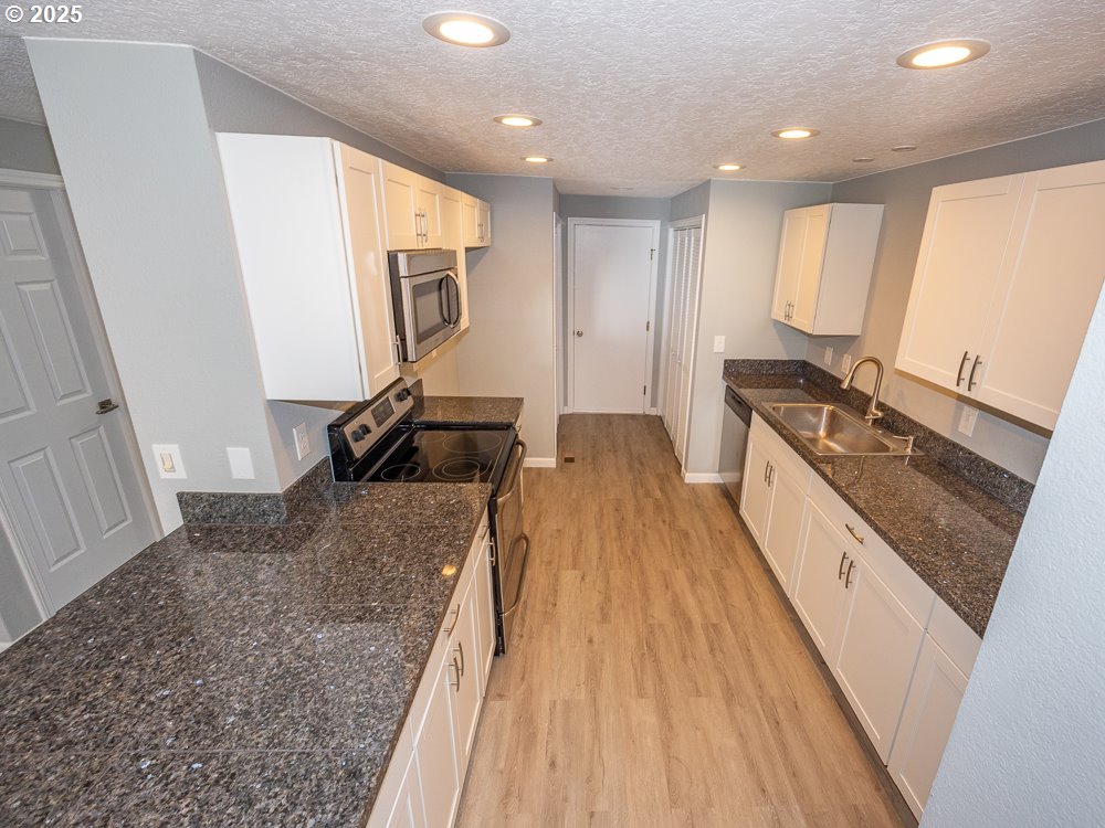 3318 Northeast 29th Street Gresham, OR 97030 - Photo 8 of 32 a spacious bathroom with a granite countertop sink