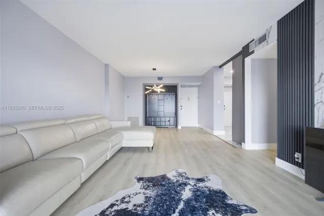 a living room with a couch and a flat screen tv