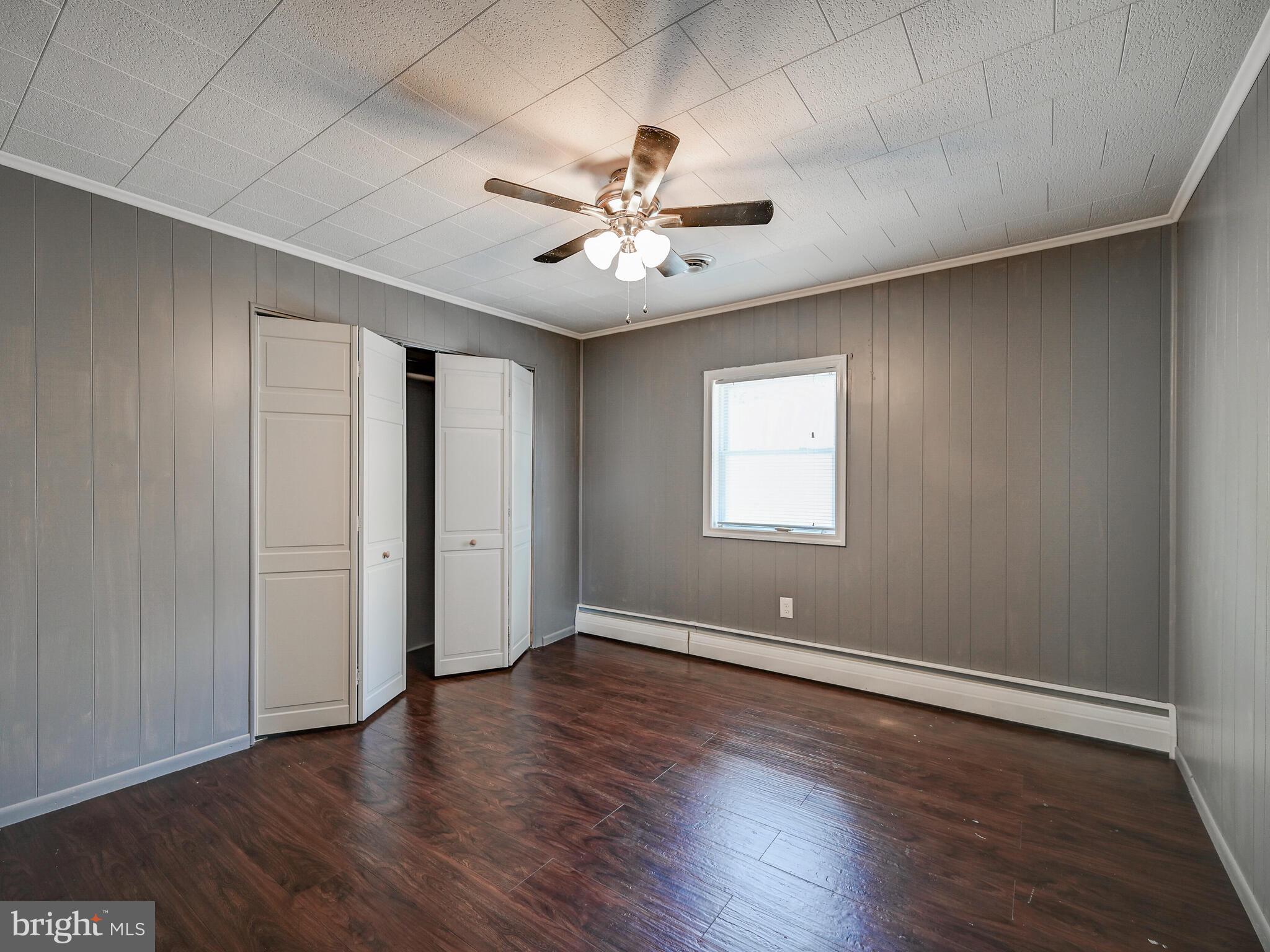 2512 Barrison Point Road Baltimore, MD 21221 - Photo 18 of 44 Bedroom 2 with ceiling fan and wardrobe