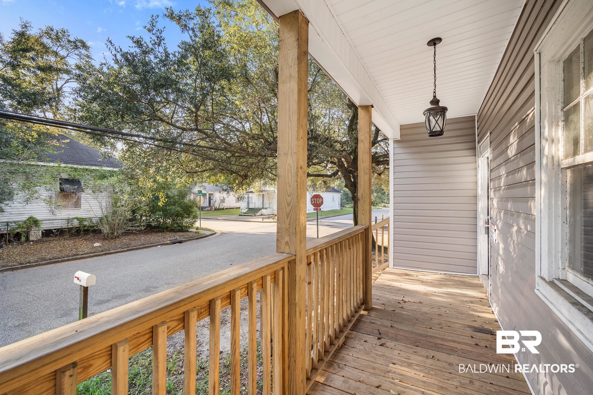 401 Gaston Street Mobile, AL 36603 - Photo 2 of 17 Wooden deck with a porch