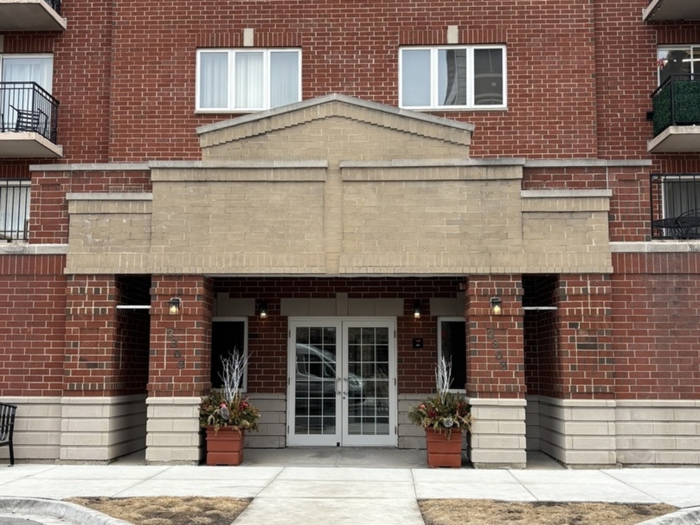 3303 Grove Avenue, Unit 310 Berwyn, IL 60402 - Photo 1 of 21 a front view of a building with glass windows