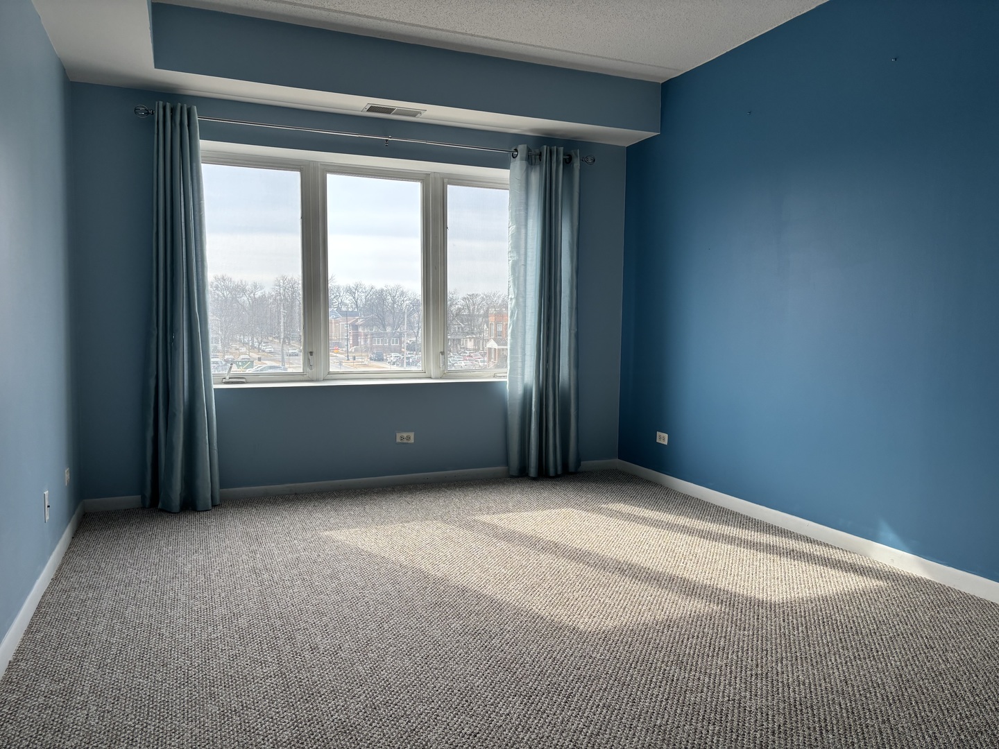 3303 Grove Avenue, Unit 310 Berwyn, IL 60402 - Photo 11 of 21 an empty room with a window