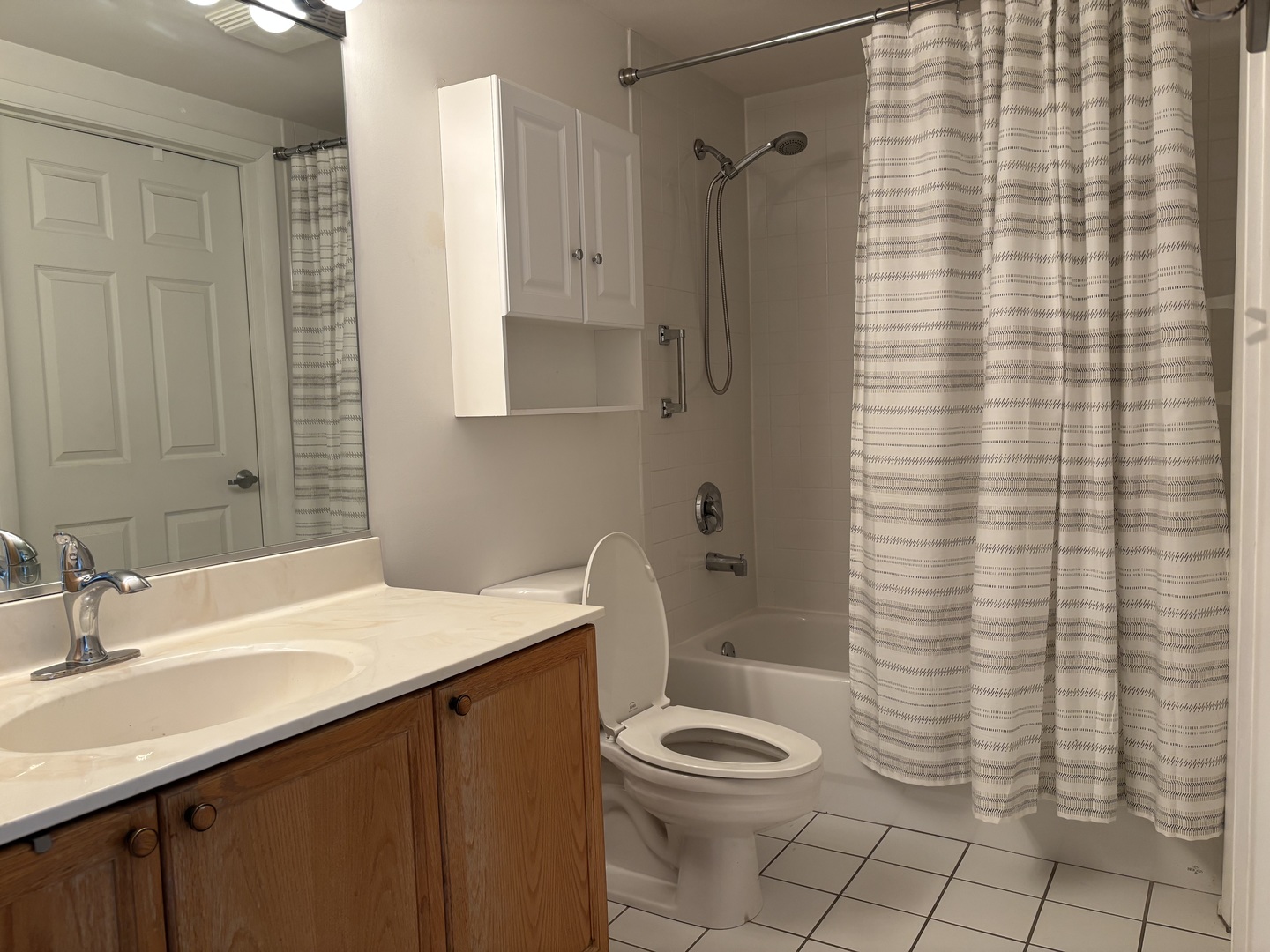 3303 Grove Avenue, Unit 310 Berwyn, IL 60402 - Photo 14 of 21 a bathroom with a sink a toilet and shower