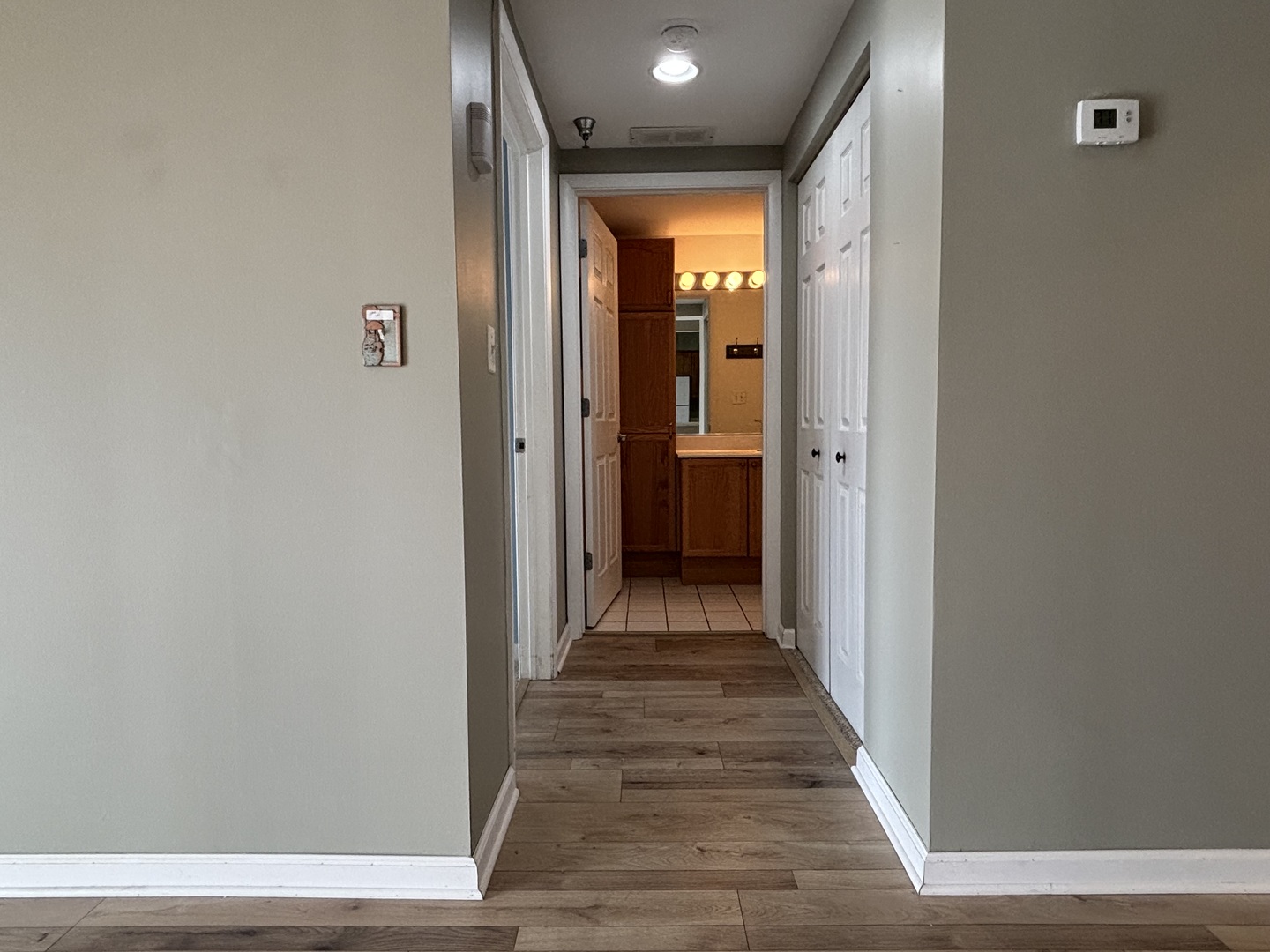 3303 Grove Avenue, Unit 310 Berwyn, IL 60402 - Photo 19 of 21 a view of a hallway with wooden floor
