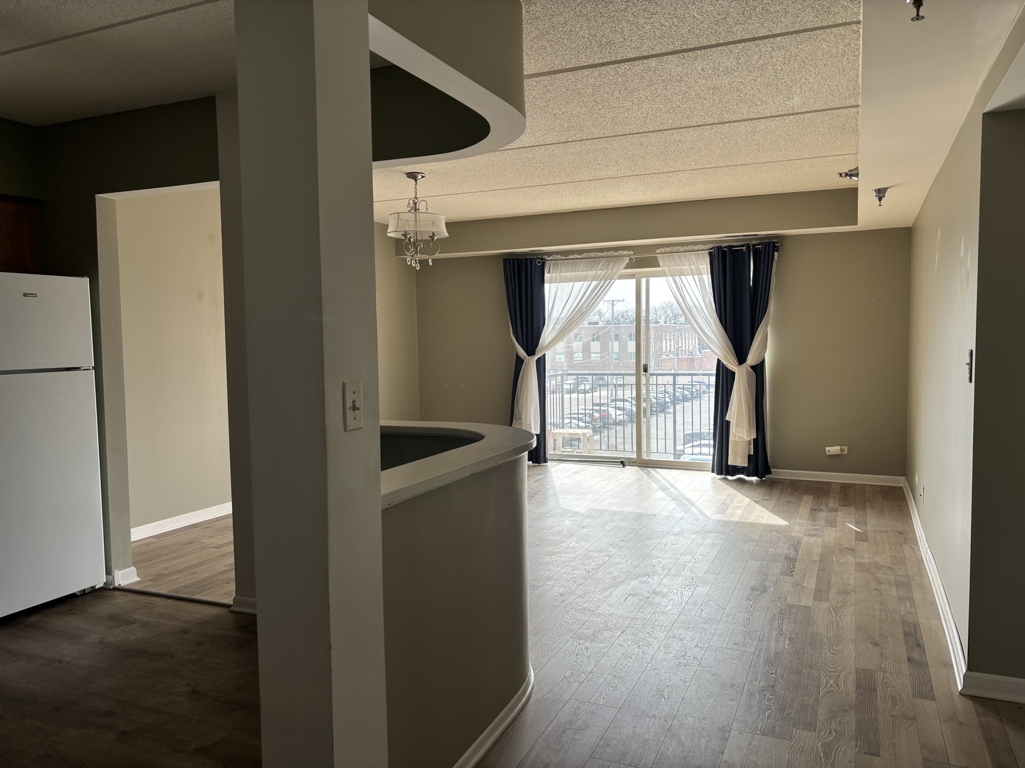 3303 Grove Avenue, Unit 310 Berwyn, IL 60402 - Photo 4 of 21 a view of empty room with wooden floor and fan