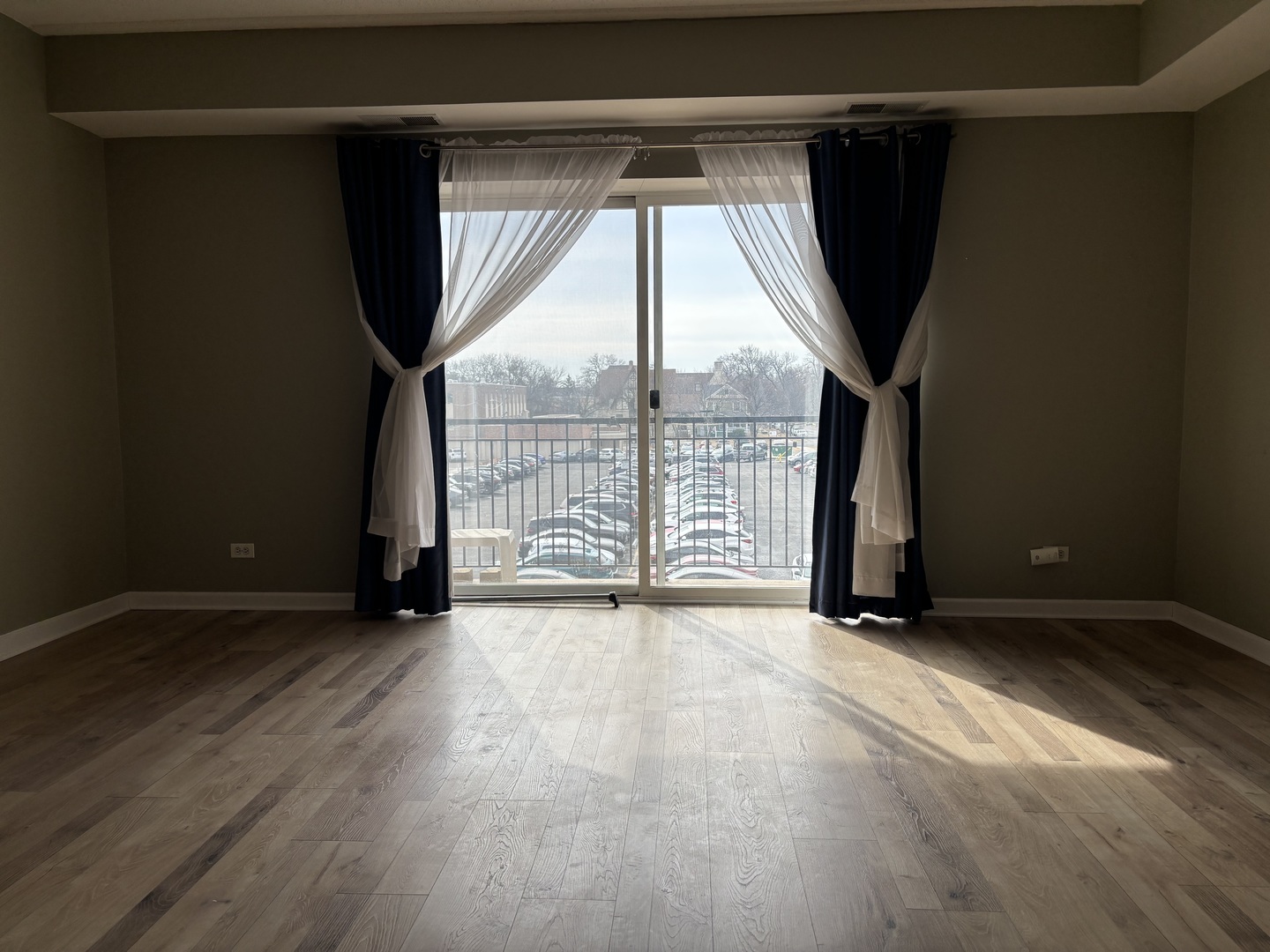 3303 Grove Avenue, Unit 310 Berwyn, IL 60402 - Photo 5 of 21 an empty room with windows