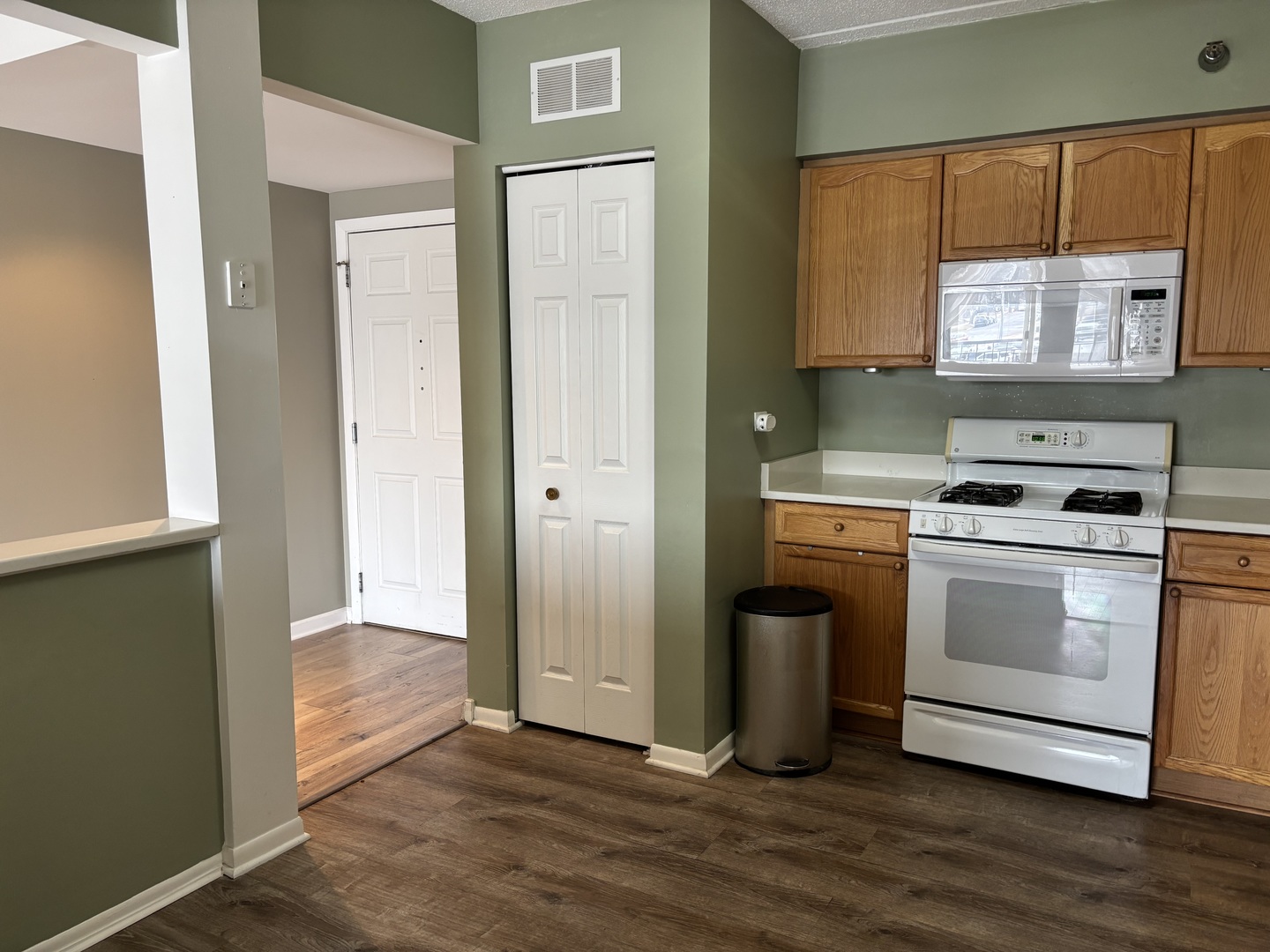 3303 Grove Avenue, Unit 310 Berwyn, IL 60402 - Photo 9 of 21 a kitchen with a stove and a refrigerator