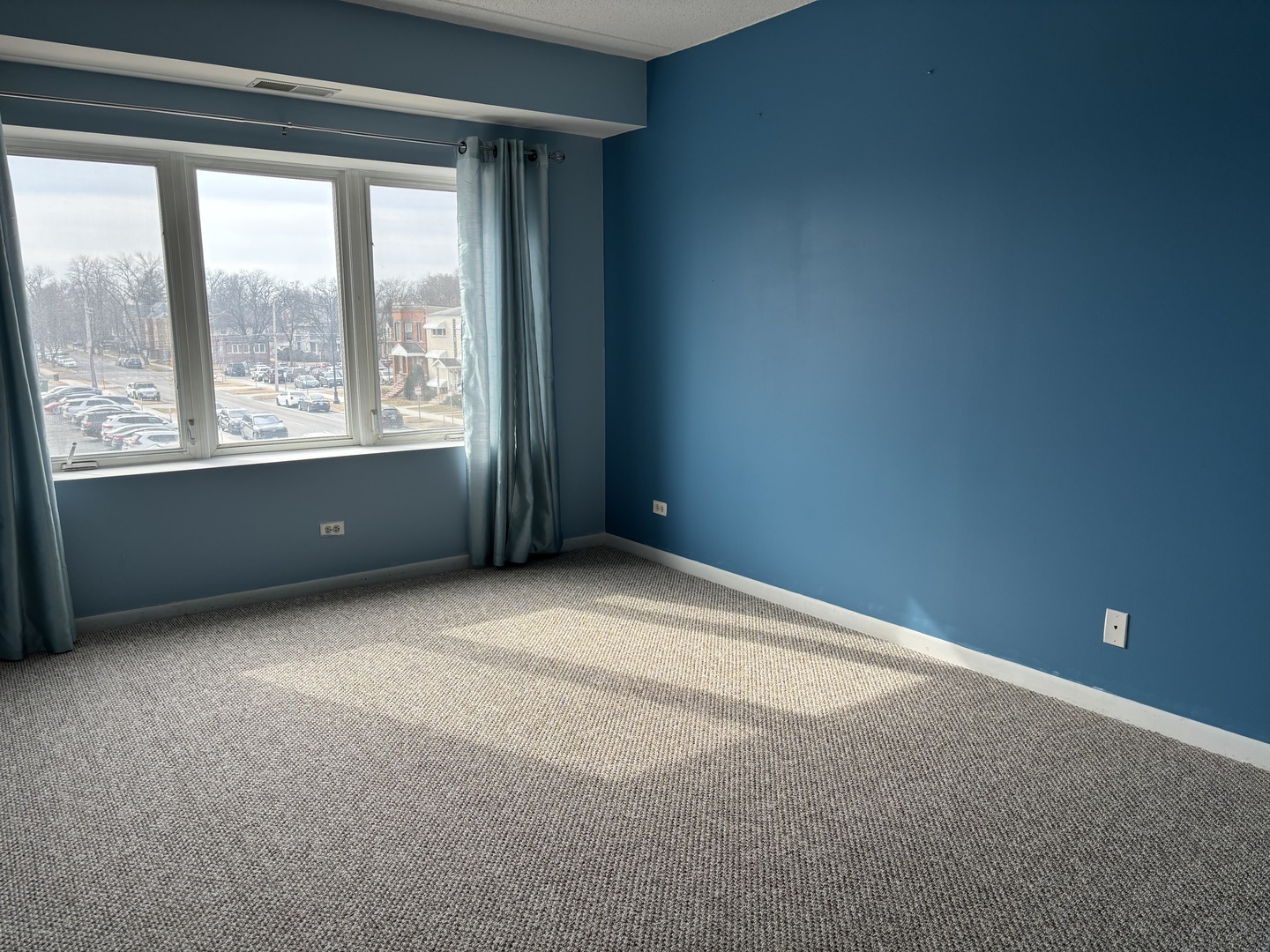 3303 Grove Avenue, Unit 310 Berwyn, IL 60402 - Photo 10 of 21 a view of an empty room with a window