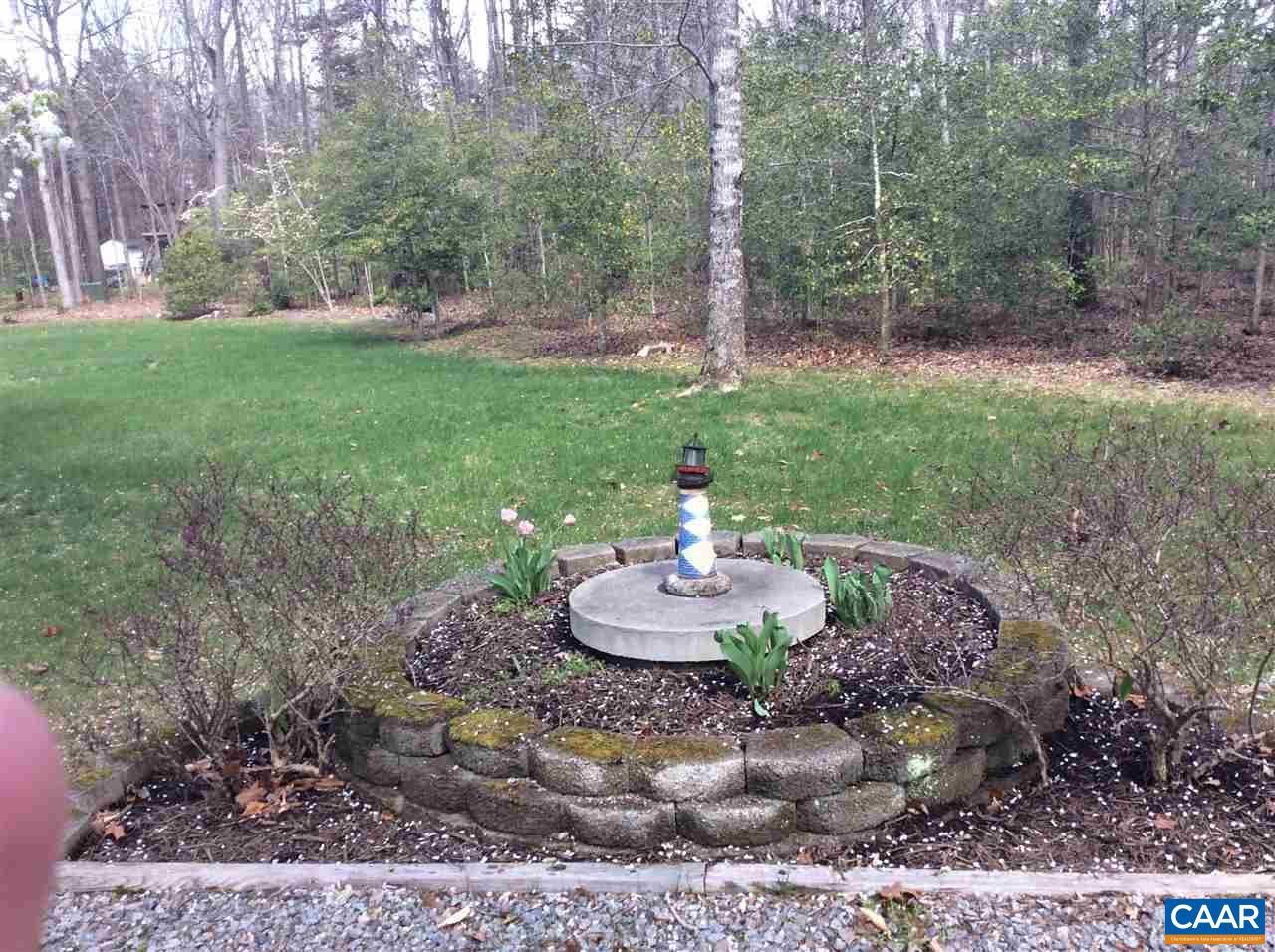 1637 Buckner Road Bumpass, VA 23024 - Photo 14 of 14 a table and chairs in a garden