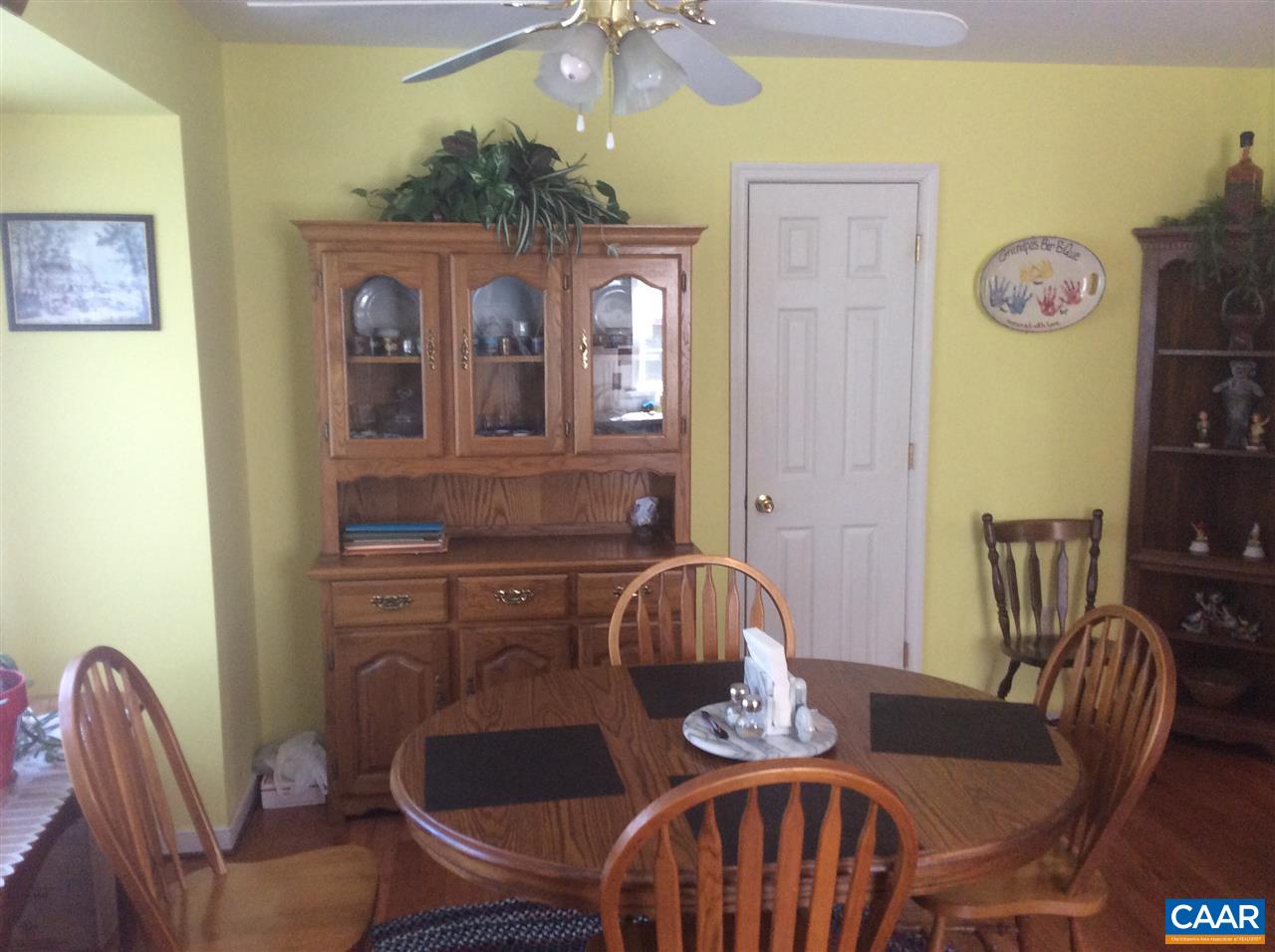 1637 Buckner Road Bumpass, VA 23024 - Photo 3 of 14 a dining room with furniture and wooden floor